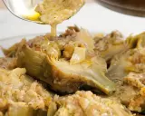 Carciofi alla romana ricetta: carciofi stufati con un condimento saporito, pronti per essere gustati.