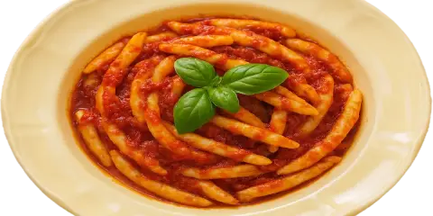 Pasta with tomato sauce and basil in a yellow bowl.