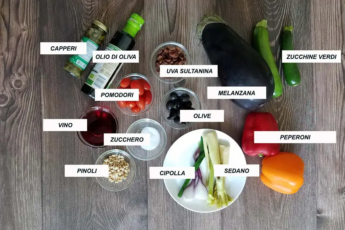 Ingredienti per la caponata siciliana ricetta della nonna: melanzana, zucchine, pomodori, peperoni, cipolla, sedano, olive, capperi, uva sultanina, pinoli, olio, vino, zucchero.